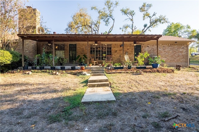 rear view of house with a patio and ceiling fan