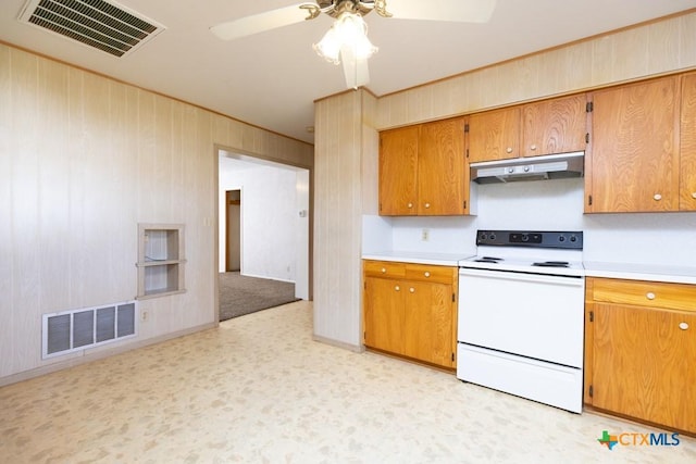 kitchen featuring light countertops, electric range, visible vents, and under cabinet range hood