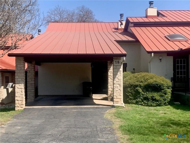 195 Gallagher Dr Unit 18, Canyon Lake, TX 78133 - exterior space with driveway, a standing seam roof, stone siding, metal roof, and a carport