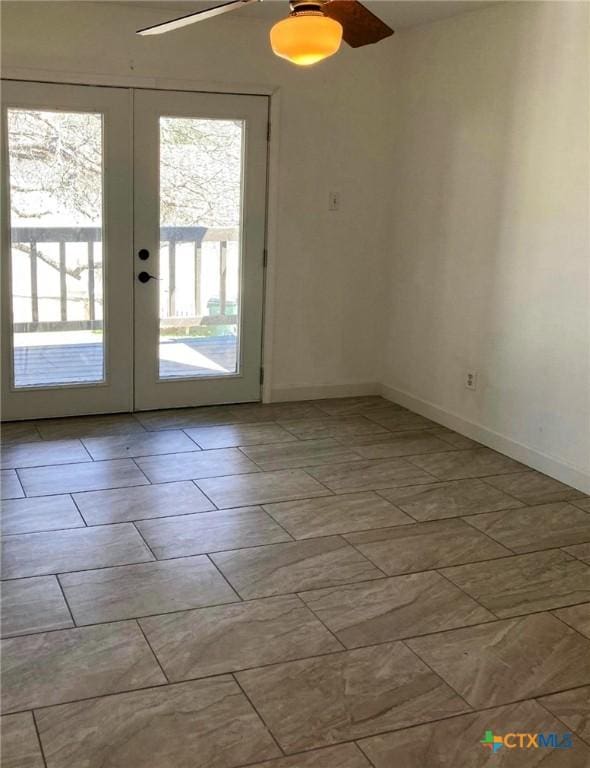 195 Gallagher Dr Unit 18, Canyon Lake, TX 78133 - spare room featuring baseboards, ceiling fan, and french doors