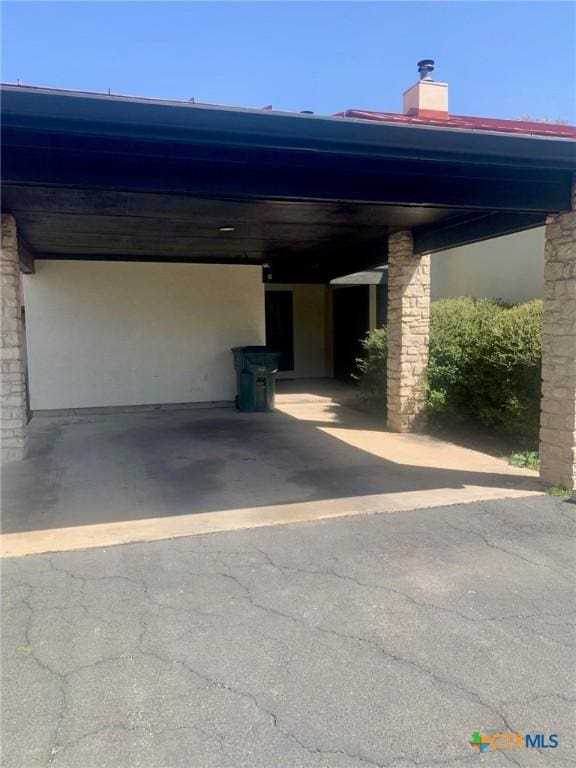 195 Gallagher Dr Unit 18, Canyon Lake, TX 78133 - view of car parking featuring an attached carport