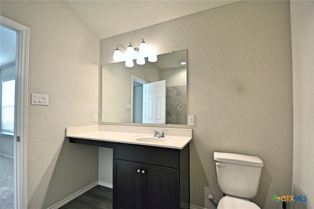 475 Autumn Leaf Dr, New Braunfels, TX 78130 - bathroom featuring vanity, wood finished floors, and a textured wall