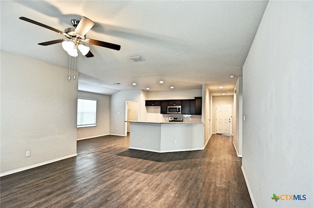 475 Autumn Leaf Dr, New Braunfels, TX 78130 - kitchen with appliances with stainless steel finishes, dark wood-style floors, recessed lighting, open floor plan, and ceiling fan