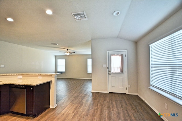 475 Autumn Leaf Dr, New Braunfels, TX 78130 - kitchen with dishwasher, dark brown cabinetry, ceiling fan, dark wood finished floors, and light stone countertops