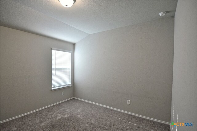 475 Autumn Leaf Dr, New Braunfels, TX 78130 - carpeted spare room featuring a smoke detector, vaulted ceiling, and a textured ceiling
