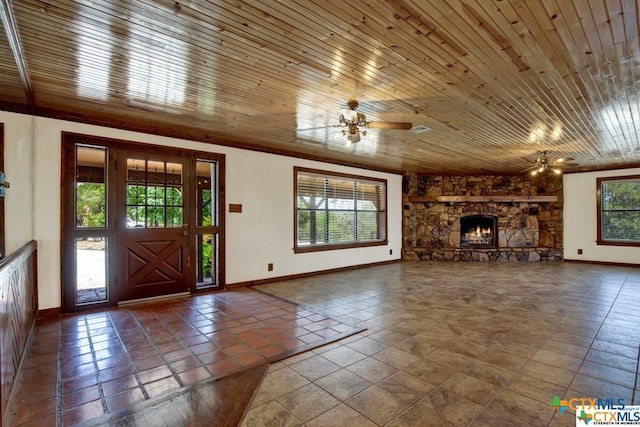 unfurnished living room with ceiling fan, wood ceiling, tile patterned floors, and a fireplace