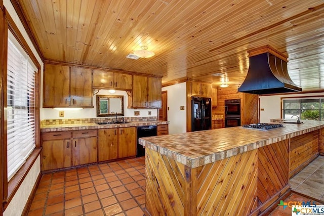 kitchen featuring wood ceiling, island exhaust hood, black appliances, sink, and light tile patterned flooring