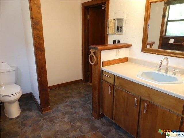 bathroom with toilet and vanity