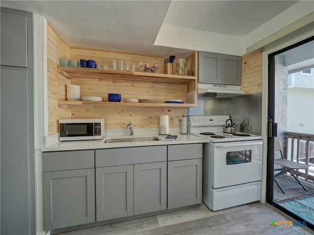 kitchen featuring gray cabinets, white electric range, sink, and light wood-type flooring