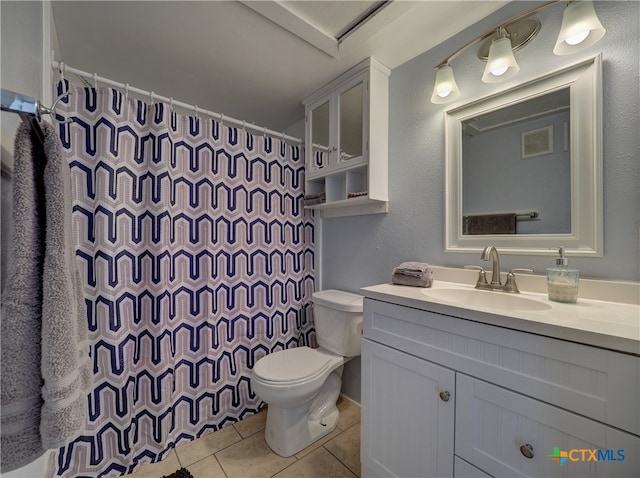 bathroom with walk in shower, tile patterned flooring, vanity, and toilet