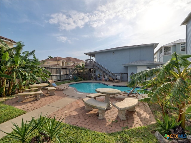 view of pool featuring a patio