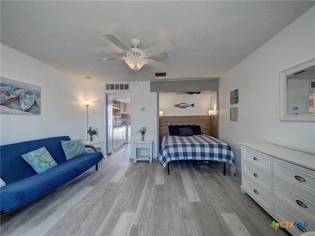 bedroom featuring light hardwood / wood-style flooring and ceiling fan