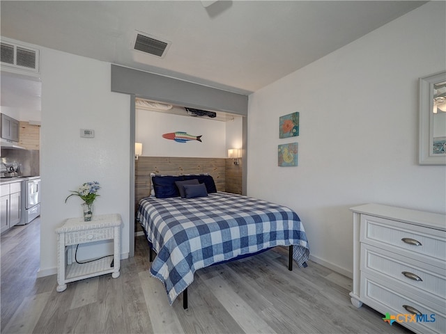 bedroom with light hardwood / wood-style flooring