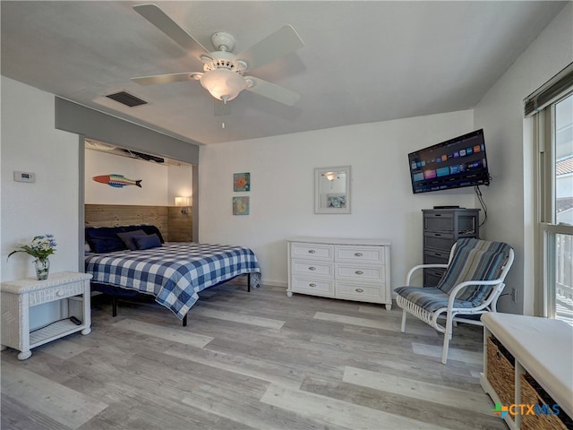 bedroom with light wood-type flooring and ceiling fan