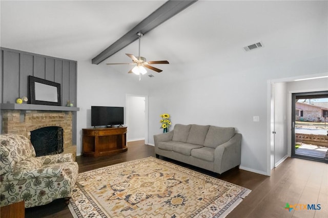 118 Byron Ln, Victoria, TX 77901 - living room featuring dark wood-type flooring, a ceiling fan, and a brick fireplace