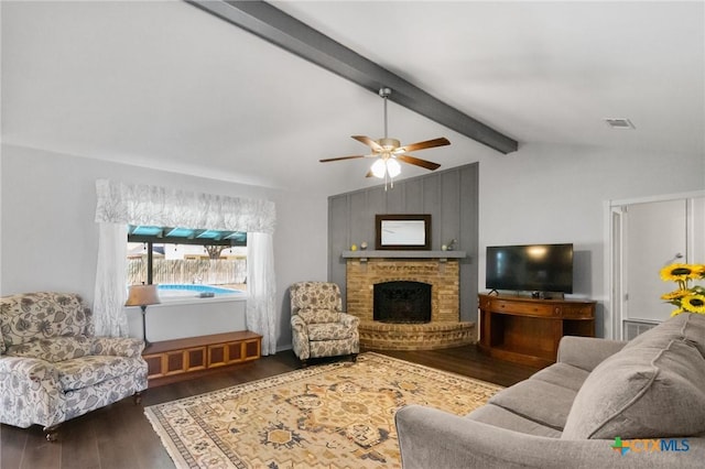 118 Byron Ln, Victoria, TX 77901 - living room featuring wood finished floors, ceiling fan, and a brick fireplace