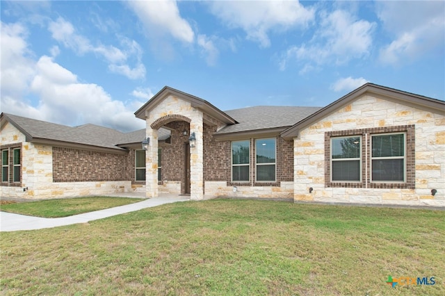 ranch-style house with a front yard