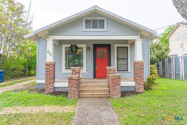 356 Kessler St, New Braunfels, TX 78130 - living room featuring wooden walls, visible vents, and a ceiling fan