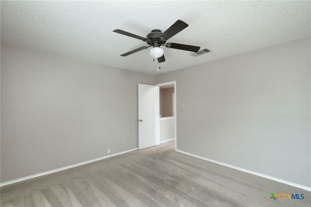 1335 Lakeside Loop, Round Rock, TX 78665 - unfurnished room with ceiling fan, carpet flooring, and a textured ceiling