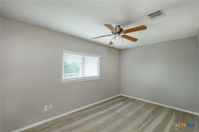 1335 Lakeside Loop, Round Rock, TX 78665 - carpeted empty room with a ceiling fan and a textured ceiling