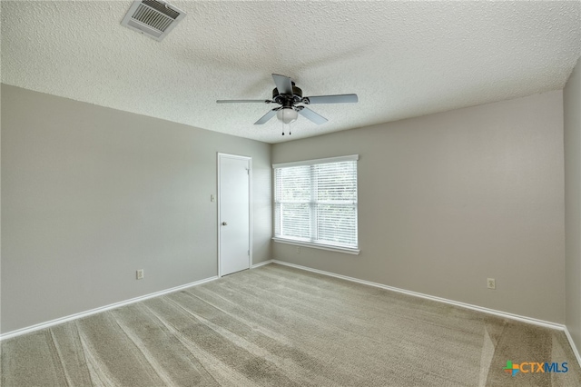 1335 Lakeside Loop, Round Rock, TX 78665 - carpeted empty room with a ceiling fan and a textured ceiling