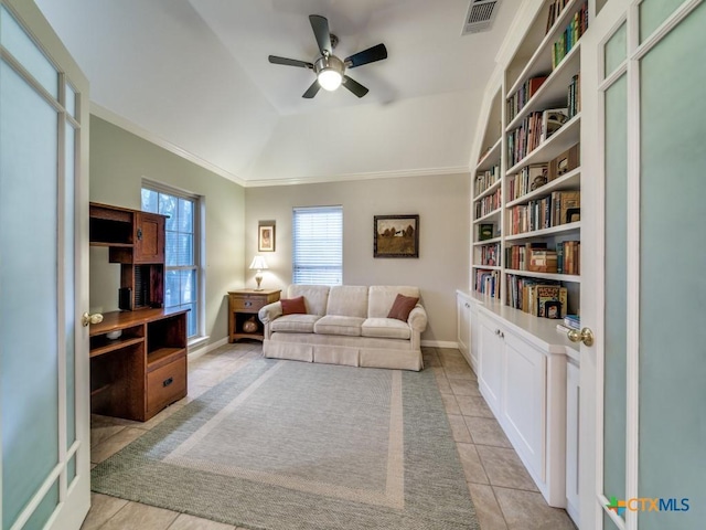 2615 Foresthaven Dr, New Braunfels, TX 78132 - tiled living room with ornamental molding, ceiling fan, baseboards, a tray ceiling, and built in shelves