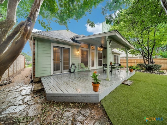 2615 Foresthaven Dr, New Braunfels, TX 78132 - back of property featuring a deck, a chimney, french doors, and a shingled roof