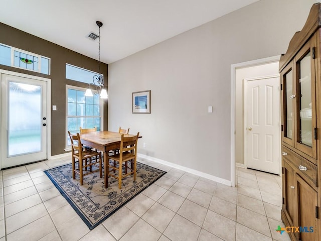 2615 Foresthaven Dr, New Braunfels, TX 78132 - dining space with light tile patterned flooring, baseboards, and a chandelier