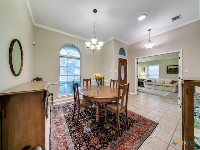 2615 Foresthaven Dr, New Braunfels, TX 78132 - dining space with ornamental molding, a chandelier, and light tile patterned floors