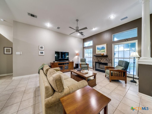 2615 Foresthaven Dr, New Braunfels, TX 78132 - living area featuring ornate columns, light tile patterned floors, ceiling fan, a fireplace, and recessed lighting