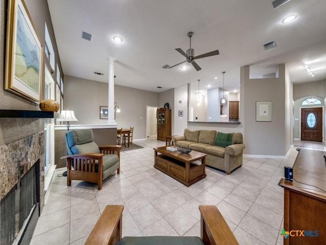 2615 Foresthaven Dr, New Braunfels, TX 78132 - living room with ceiling fan, light tile patterned floors, baseboards, a fireplace, and recessed lighting