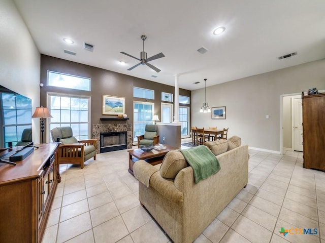 2615 Foresthaven Dr, New Braunfels, TX 78132 - living room featuring ceiling fan, light tile patterned flooring, a tile fireplace, recessed lighting, and baseboards
