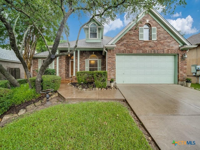 2615 Foresthaven Dr, New Braunfels, TX 78132 - traditional-style house featuring driveway, brick siding, roof with shingles, and a garage