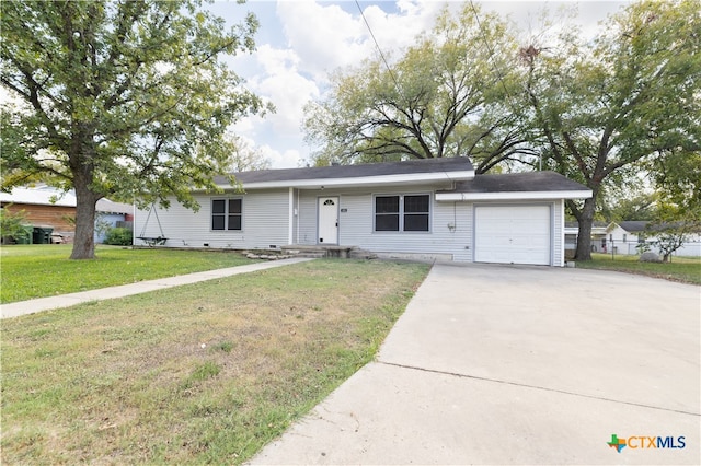 ranch-style home with a garage and a front yard