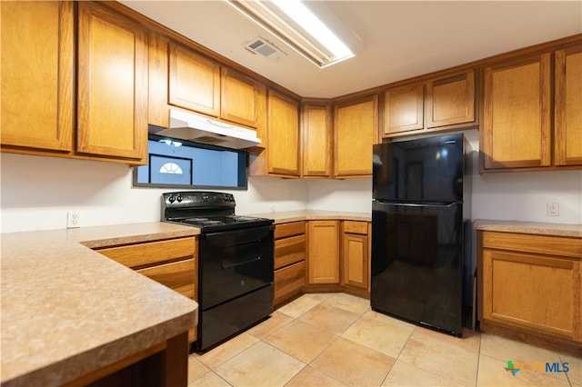 kitchen featuring black appliances and light tile patterned floors