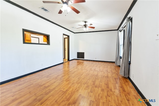 spare room featuring light hardwood / wood-style flooring, ceiling fan, and crown molding