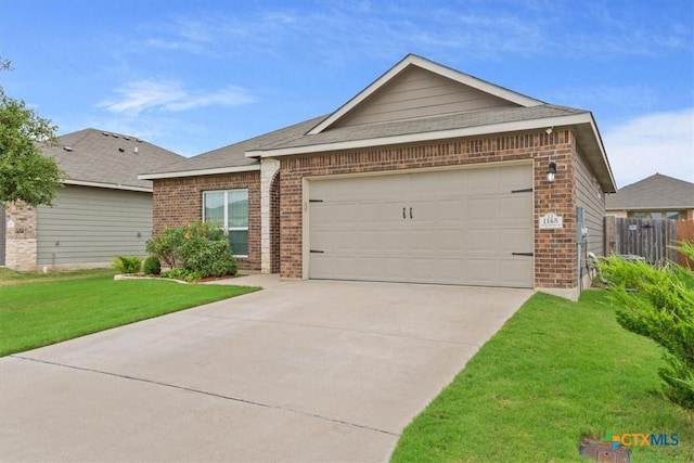 ranch-style home with a garage and a front lawn