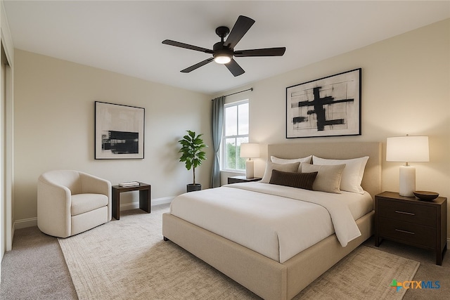 1123 Sundrop Pl, Round Rock, TX 78665 - bedroom with light colored carpet, baseboards, and a ceiling fan