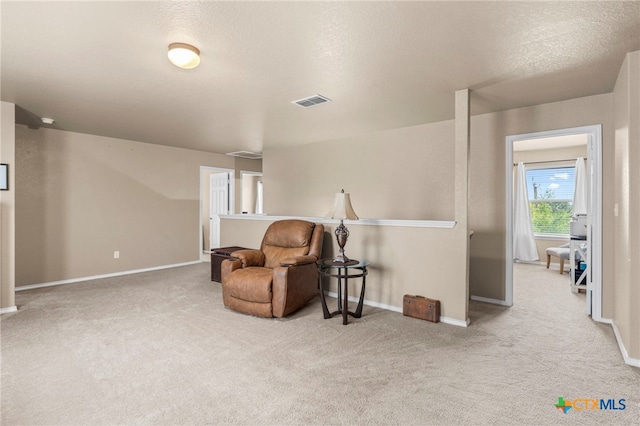 12530 Crockett Way, San Antonio, TX 78253 - living area featuring carpet, an upstairs landing, and a textured ceiling