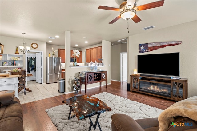 12530 Crockett Way, San Antonio, TX 78253 - living room featuring a chandelier, light wood-type flooring, a ceiling fan, and recessed lighting