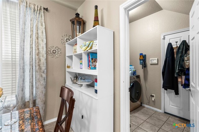 12530 Crockett Way, San Antonio, TX 78253 - laundry room with washer / clothes dryer and light tile patterned flooring