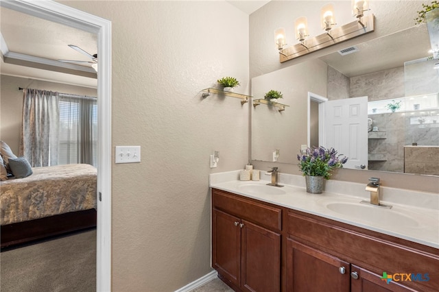 12530 Crockett Way, San Antonio, TX 78253 - bathroom featuring double vanity, ensuite bathroom, a textured wall, and a shower