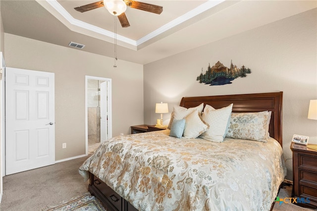 12530 Crockett Way, San Antonio, TX 78253 - carpeted bedroom featuring a raised ceiling, connected bathroom, ceiling fan, and ornamental molding