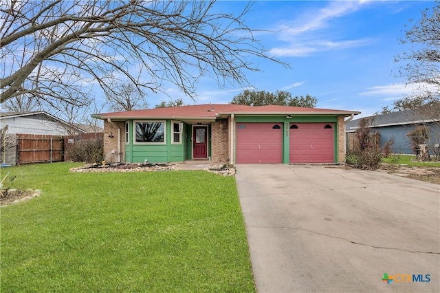 ranch-style house featuring a garage and a front yard