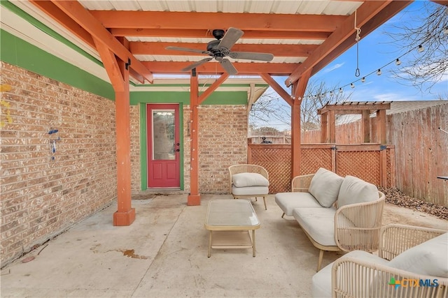 view of patio with ceiling fan and an outdoor hangout area