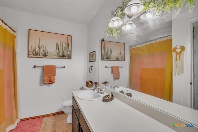 bathroom featuring toilet, tile patterned flooring, a shower with curtain, and vanity