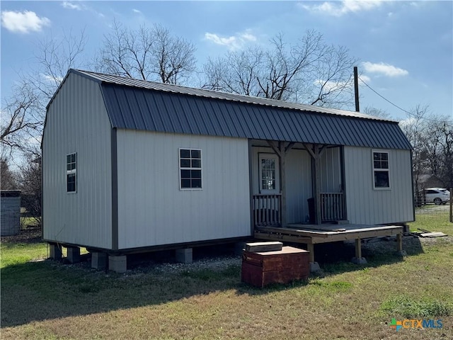 exterior space with a lawn and an outdoor structure