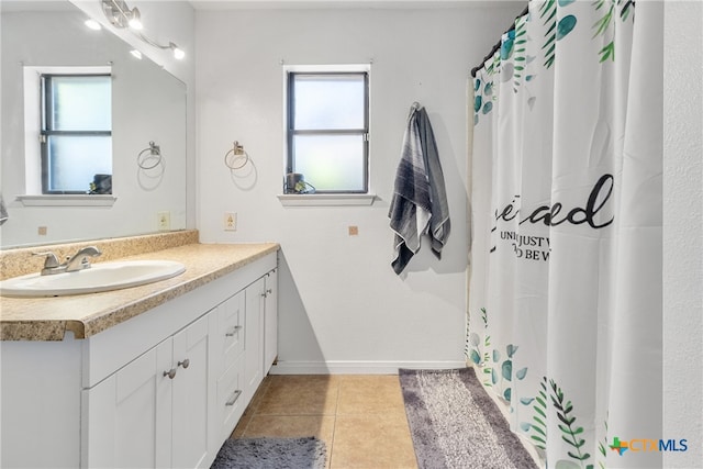 bathroom featuring vanity, tile patterned floors, and a wealth of natural light