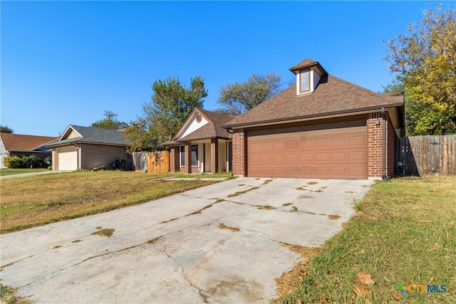 view of front facade with a garage and a front lawn