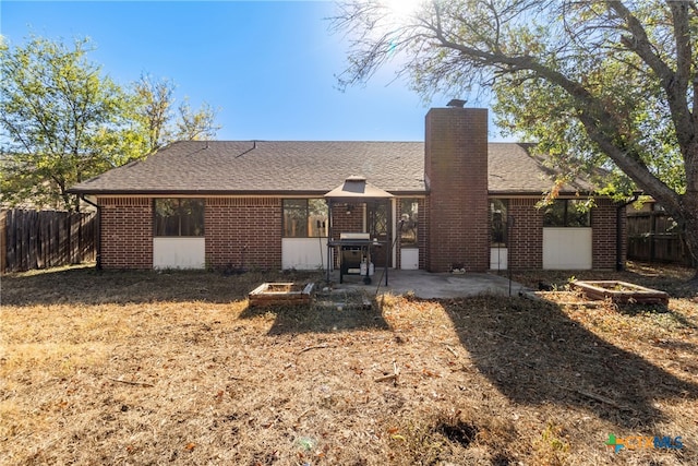 rear view of property with a patio